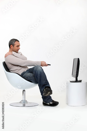 Photo: Man watching television Man watching television
