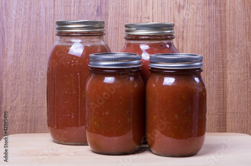 Photo: Fresh tomato sauce in jars Fresh tomato sauce in jars