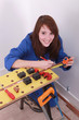 Woman measuring a copper pipe