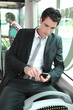 Businessman looking at mobile phone