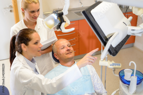 Photo: Man patient at dental consultation dentist surgery Man patient at dental consultation dentist surgery