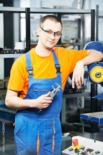 Photo: worker at tool workshop worker at tool workshop