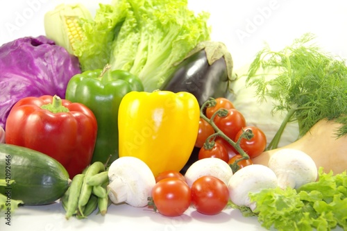 Photo: Bright healthy vegetables on white Bright healthy vegetables on white
