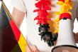 Fussballfan mit Megaphon und Fahne