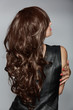 Photo: woman with long brown curly hair woman with long brown curly hair