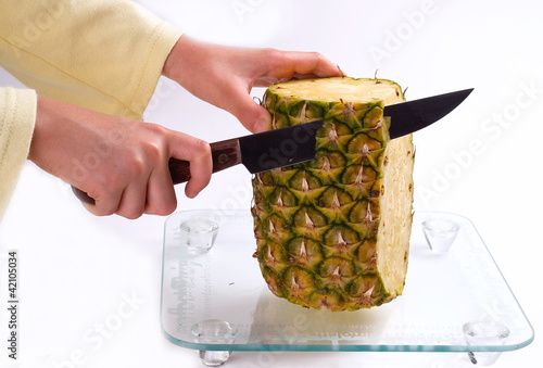 Photo: pineapple cutting pineapple cutting