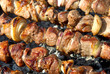 Juicy slices of meat with sauce prepare on fire - kebab