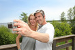 Couple in vacation taking picture of each other