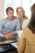 Couple meeting advisor at home