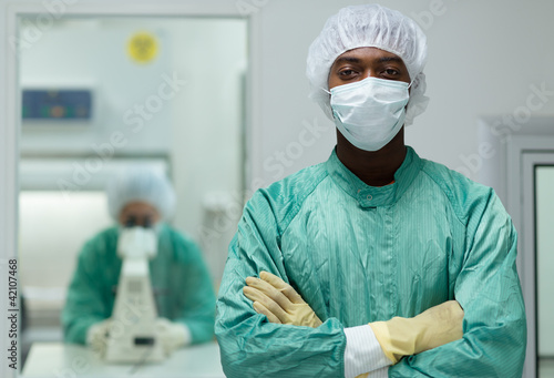 Photo: Lab staff at work in pharmaceutical laboratory Lab staff at work in pharmaceutical laboratory