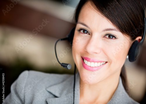Photo: Woman at a call center Woman at a call center