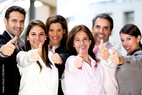 Photo: Business people with thumbs up Business people with thumbs up