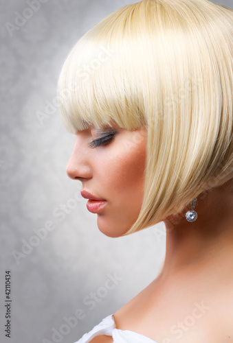 Photo: Haircut. Beautiful Girl with Healthy Short Blond Hair Haircut. Beautiful Girl with Healthy Short Blond Hair