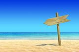 Empty wooden signpost on idyllic tropical sand beach