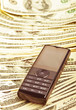 Foto: mobile phone on the money mobile phone on the money