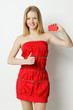 Woman holding blank credit card, showing thumb up sign