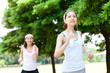 Beautiful young women running in park. Portrait of asian.