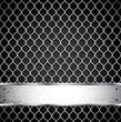 Metal fence on a dark background.