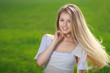 Photo: Closeup of young beautiful blond woman outdoors Closeup of young beautiful blond woman outdoors