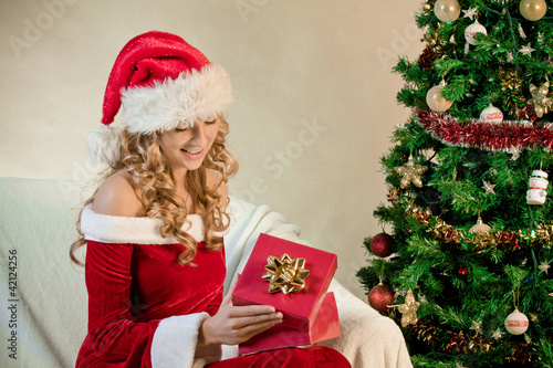 Photo: Young woman in santa hat Young woman in santa hat