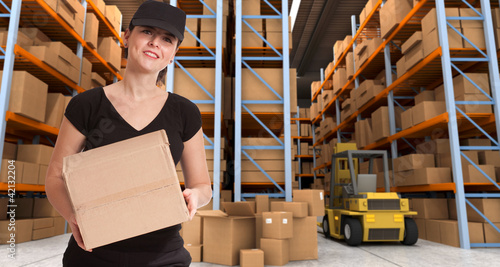 Photo: Female courier at warehouse a Female courier at warehouse a