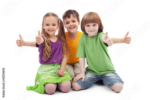 Photo: Three kids giving thumbs up sign Three kids giving thumbs up sign
