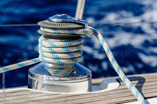 Photo: Sailing boat winch with rope closeup Sailing boat winch with rope closeup