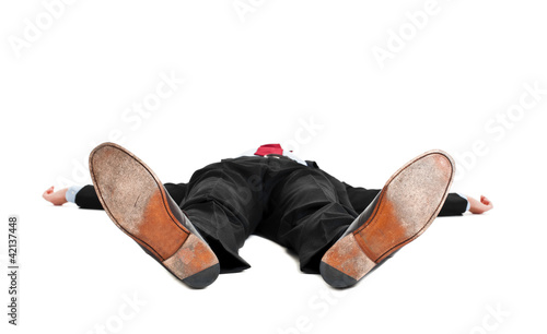 Foto: Businessman laying down on white background Businessman laying down on white background
