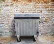 garbage container with brick wall setting