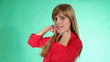 beautiful girl with a sweet smile plays with her hair