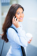 Photo: studentin telefoniert mit dem handy studentin telefoniert mit dem handy