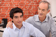 Man supporting his grandson