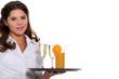 Waitress carrying tray of drinks