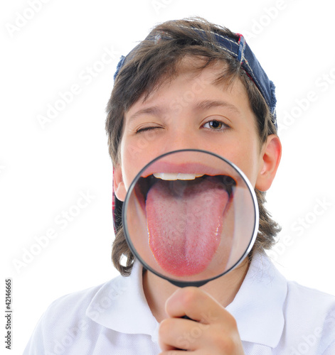 Photo: boy looking through a magnifying glass boy looking through a magnifying glass