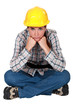 Gloomy female construction worker