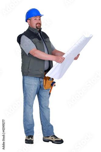 Photo: Builder looking at plans Builder looking at plans