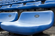 Foto: blue ordered rubber seats in a sports track field blue ordered rubber seats in a sports track field