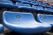 Foto: blue ordered rubber seats in a sports track field blue ordered rubber seats in a sports track field