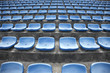 Foto: blue ordered rubber seats in a sports track field blue ordered rubber seats in a sports track field