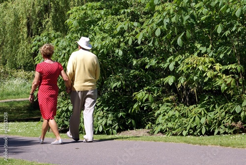 Photo: couple walking hand in hand couple walking hand in hand