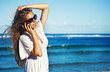 young woman with mobile phone on a beach, bali