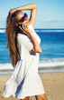 young woman with mobile phone on a beach, bali