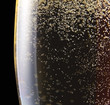 champagne in wineglass on a black background
