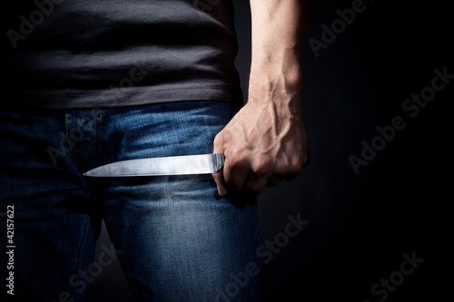 Photo: Hand with a knife Hand with a knife