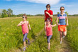 Family sport, jogging outdoors. Happy parents with kids run