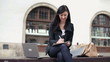 Video: Young student working on laptop and writing notes in the city Young student working on laptop and writing notes in the city