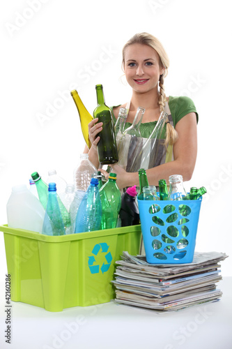 Photo: Blond woman recycling Blond woman recycling