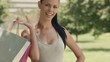 Happy young woman smiling with shopping bags