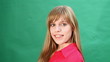beautiful girl with a sweet smile plays with her hair