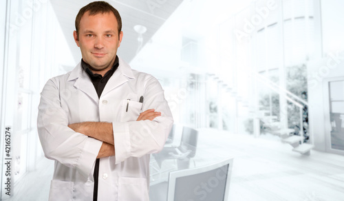Photo: Man in lab coat in a business environment Man in lab coat in a business environment